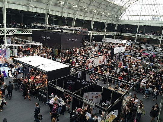 This is an image of an event of what looks like people at an event with booths.