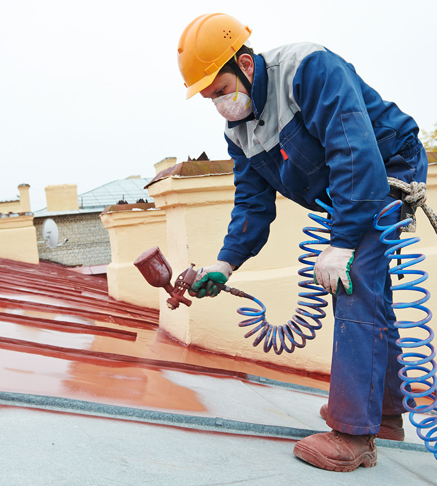 Man painting a roof