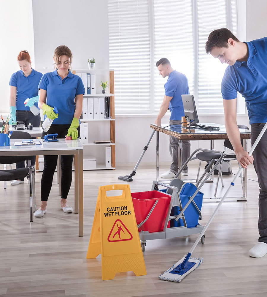 a group of people cleaning in an office