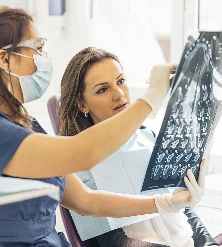 a person looking at an x-ray