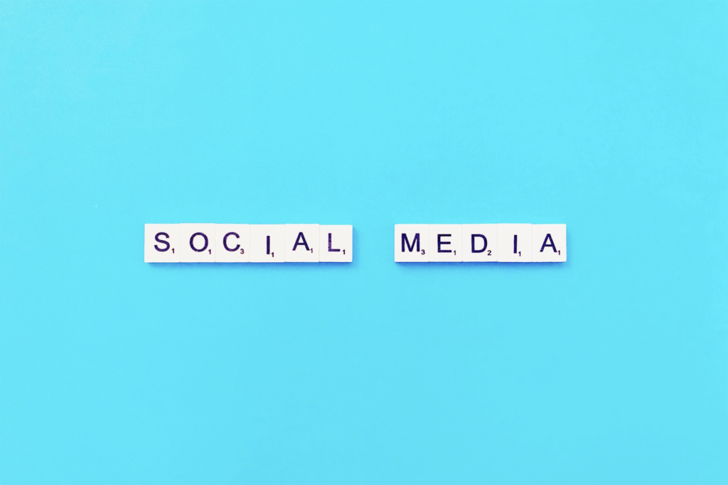 Words “social media” written on Scrabble tiles.